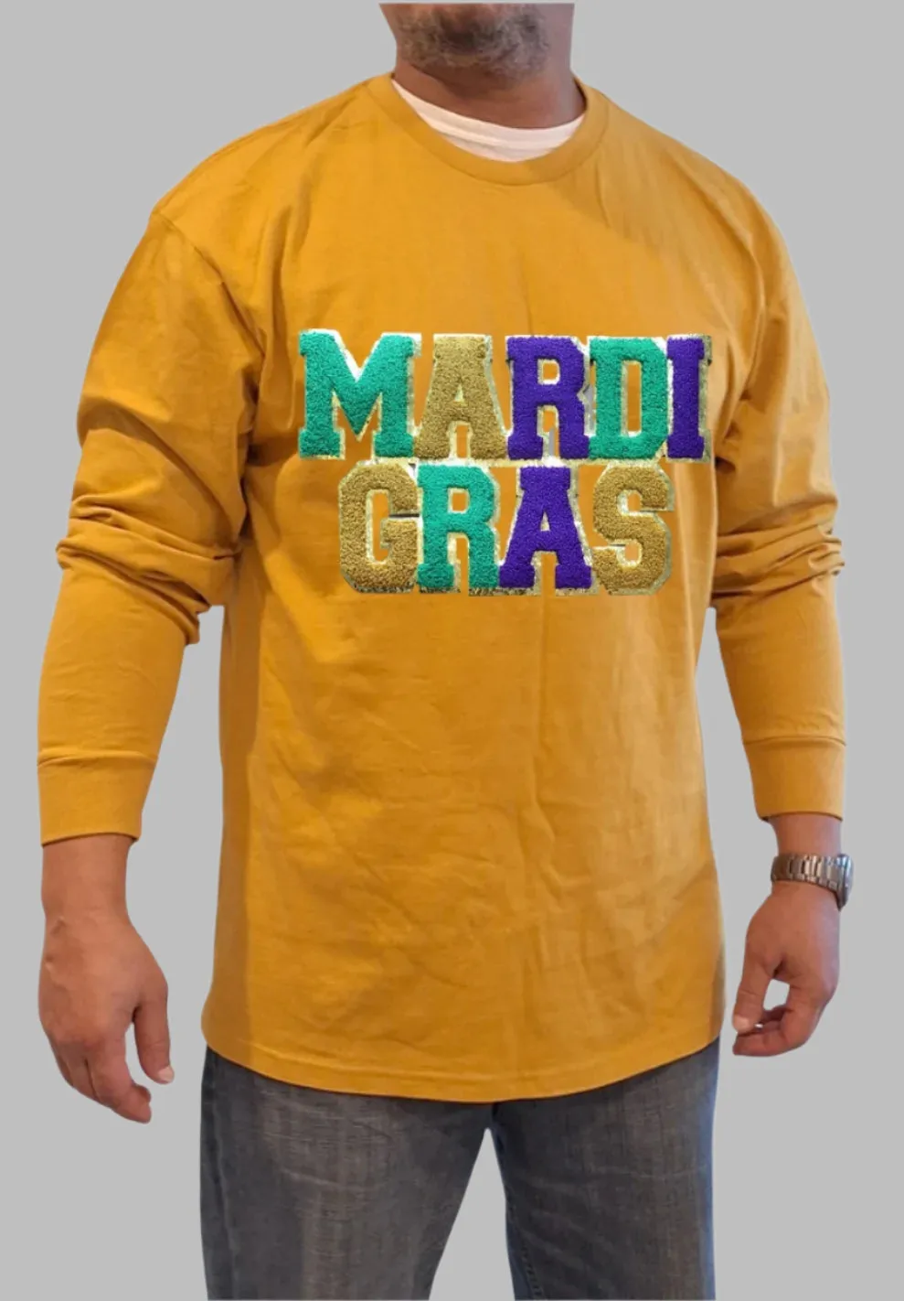 "Mardi Gras Magic: Gold Long Sleeve T-Shirt with Grand Embroidered Patch"