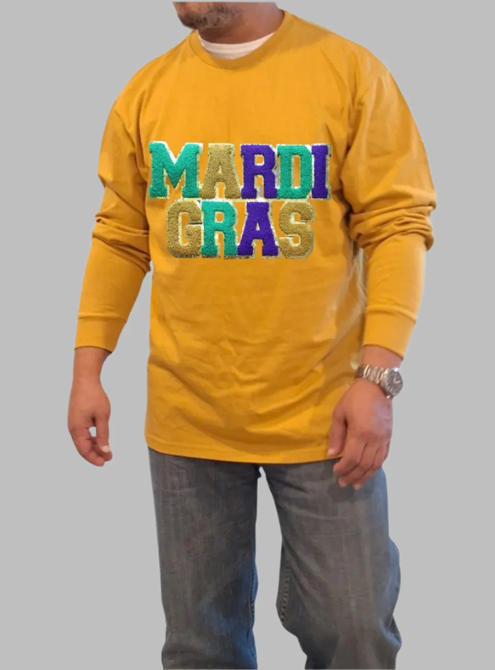 "Mardi Gras Magic: Gold Long Sleeve T-Shirt with Grand Embroidered Patch"